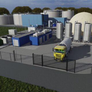 Impressie van de rwzi Echten met de slibgistingsinstallatie op de voorgrond.